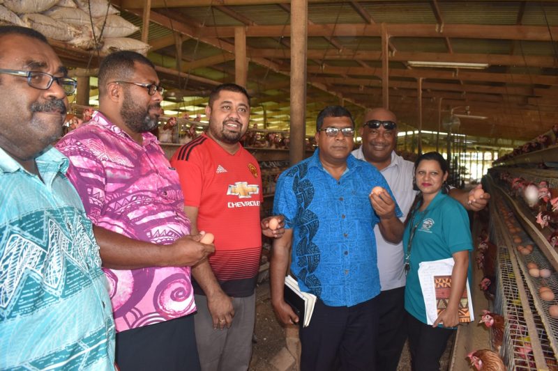 Hon.-Dr-Mahendra-Reddy-with-ministry-staff-and-farmer-at-a-poultry-farm.jpg
