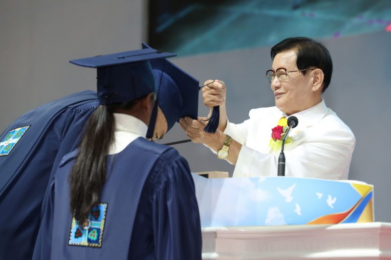 Mr.-Man-Hee-Lee-Chairman-of-Shincheonji-Church-of-Jesus-is-Crossing-the-Graduation-Cap-Tassels-of-Graduates.jpg